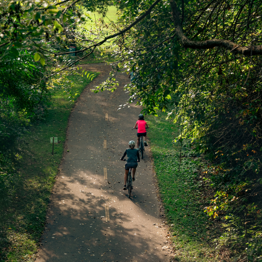 Two people on a bike trail